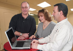 a couple and salesmen using Basement Vision software
