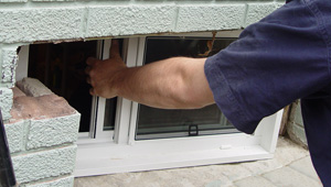 Installing new windows in a New Berlin finished basement