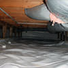 A sealed crawl space with an insulated hot air duct in Racine.