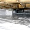 Bare floor joists in a sealed, insulated crawl space in Waukesha.