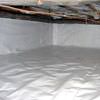 A crawl space vapor barrier has been installed on the walls and floors of this space in Crystal Lake.