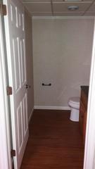 Here you can see the spacious half bathroom we created with our EverLast Vinyl Walls and ThermalDry Elite Plank Flooring in the color of Dark Walnut.