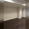 Our team created this spacious rec room with our moisture and mold resistant EverLast Vinyl Walls, ThermalDry Elite Plank Flooring in the color of Dark Walnut, and Linen Ceiling Tiles. These homeowners can't wait to show off their beautifully finished basement to all their family and friends!