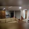 Just by changing their ceiling and flooring, these homeowners were able to re-vamp their basement to make it much more bright and beautiful!