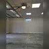The goal is to enhance the space by introducing wall insulation and Everlast wall panels, along with a drop ceiling fitted with LED light panels and additional insulation above.